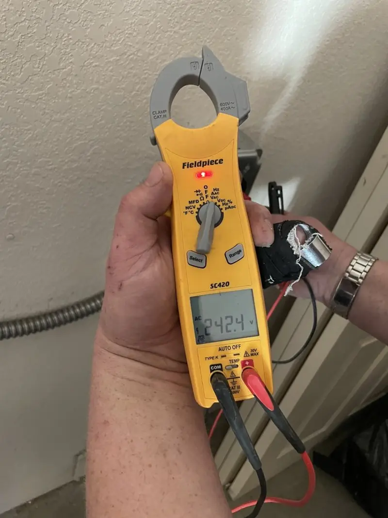 Voltage testing with clamp meter during Outlet Installation in Grantsville